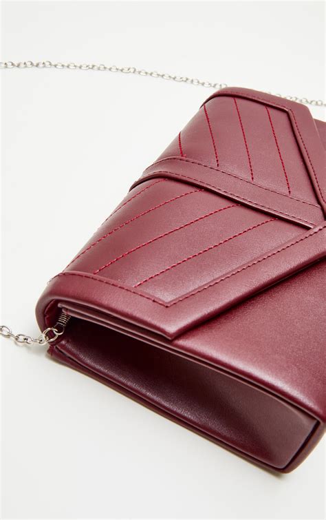 burgundy cross body bags.